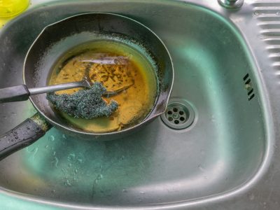 Wash The Pan And Pour The Old Oil Into The Sink Causing Clogged Sinks And Drains